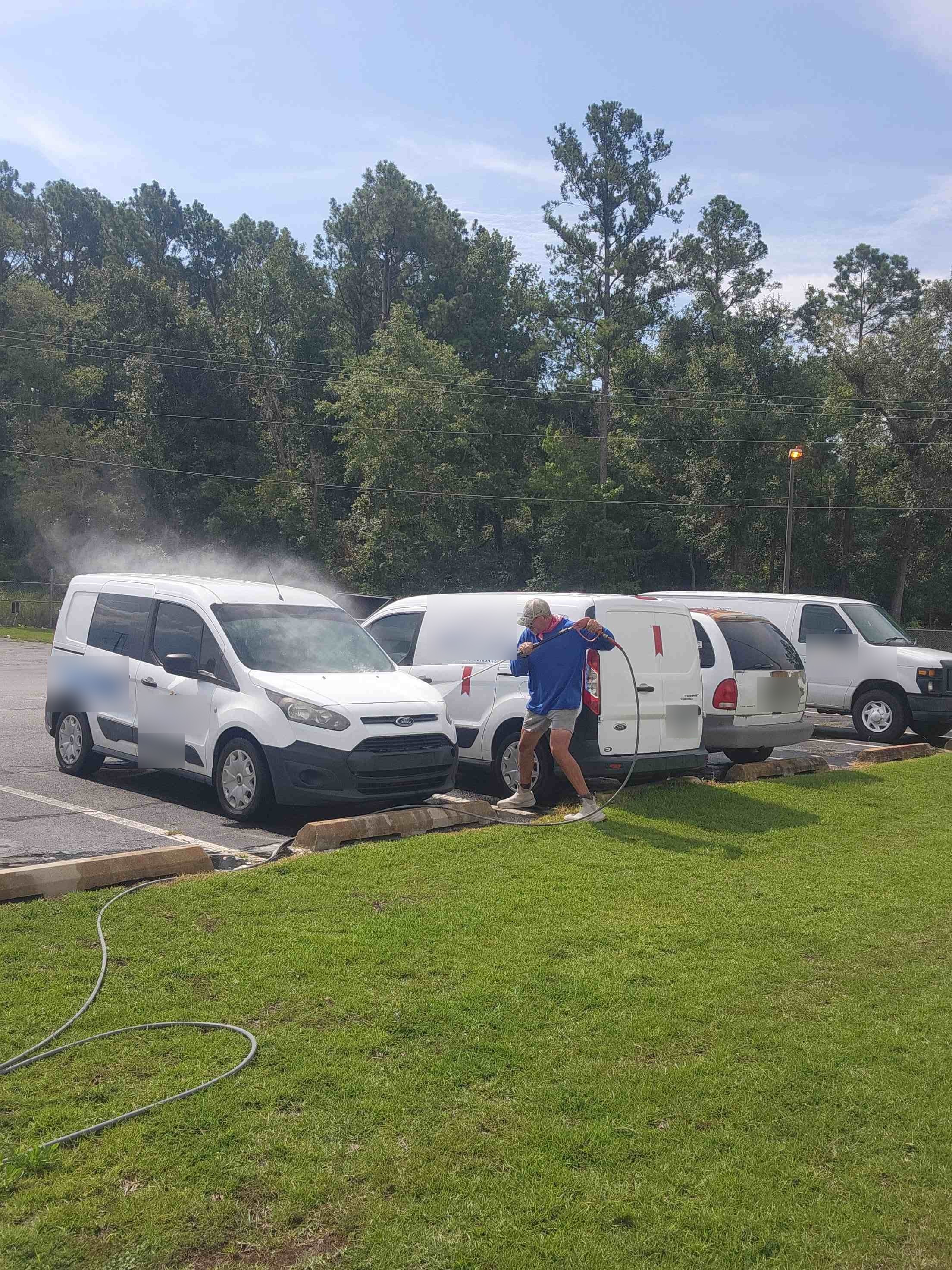 Mr Power Clean pressure washing commercial fleet vans and work trucks on site in South Georgia