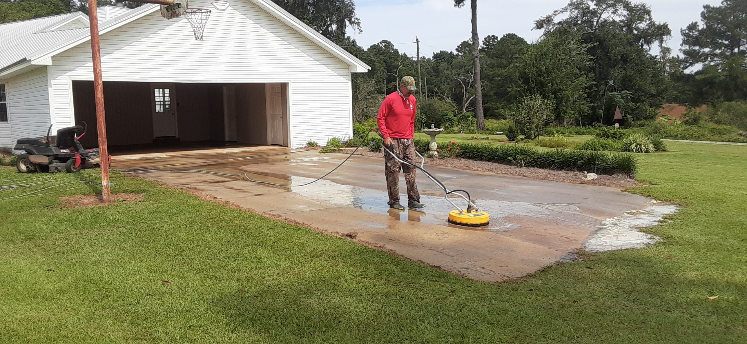 Mr Power Clean Pressure Washing rotary surface cleaner washing concrete driveway in South Georgia