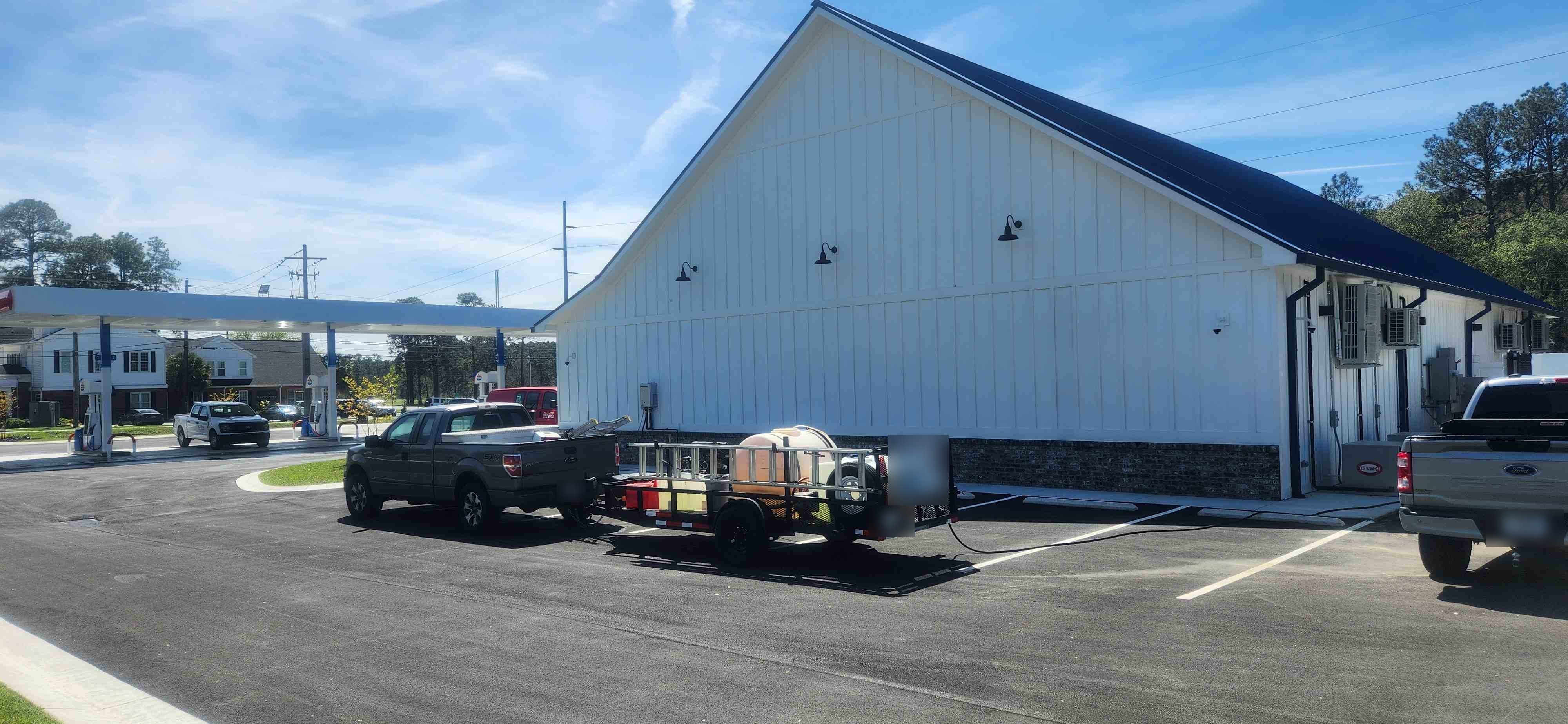 Mr Power Clean Pressure Washing truck and wash trailer at a commercial building in South Georgia.