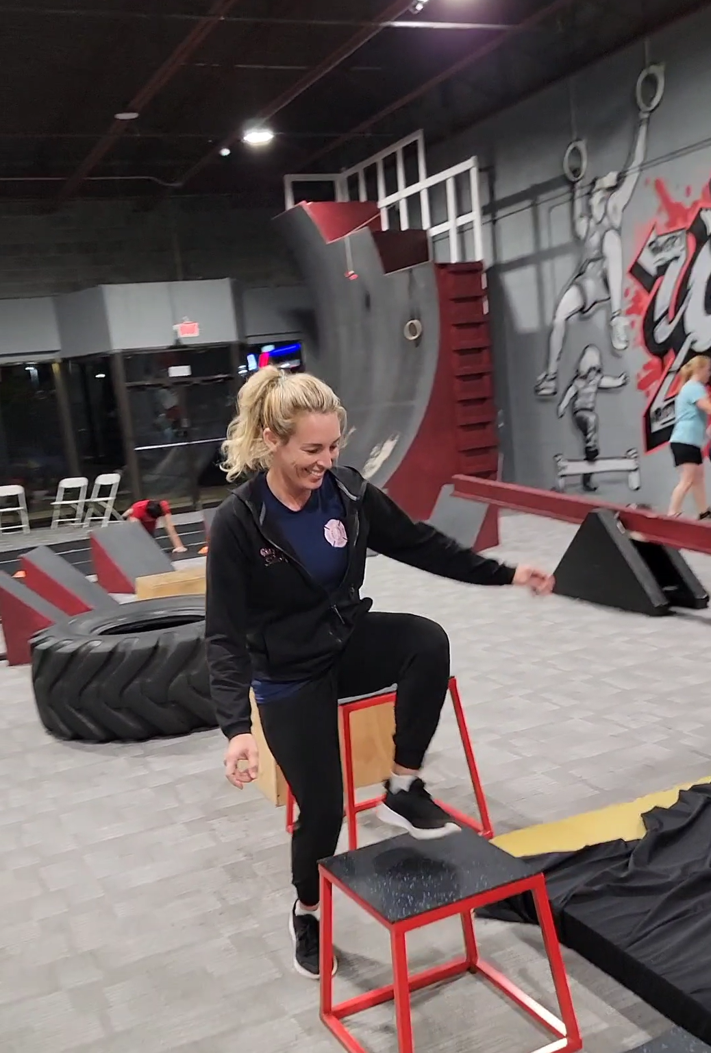 Adult obstacle training and box jumps at GRIT
