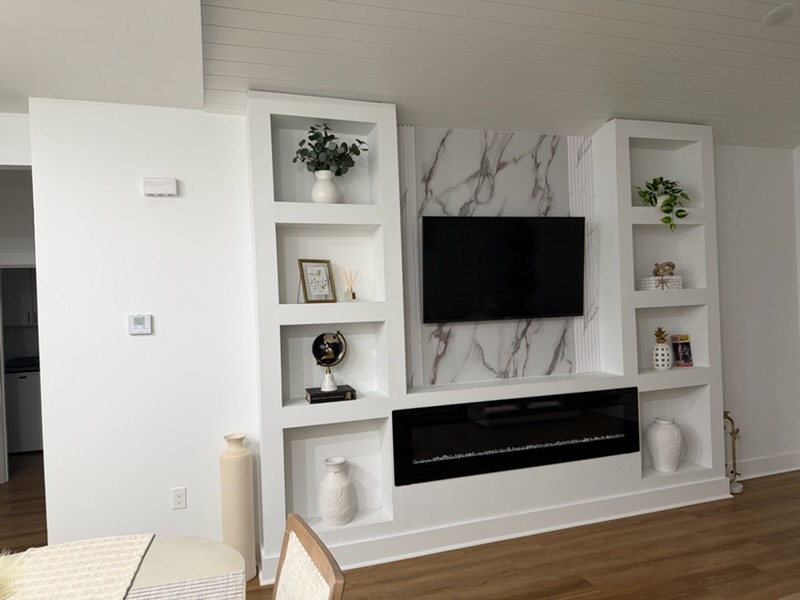 Custom Built-In Entertainment Wall with Electric Fireplace & Marble Slab Feature