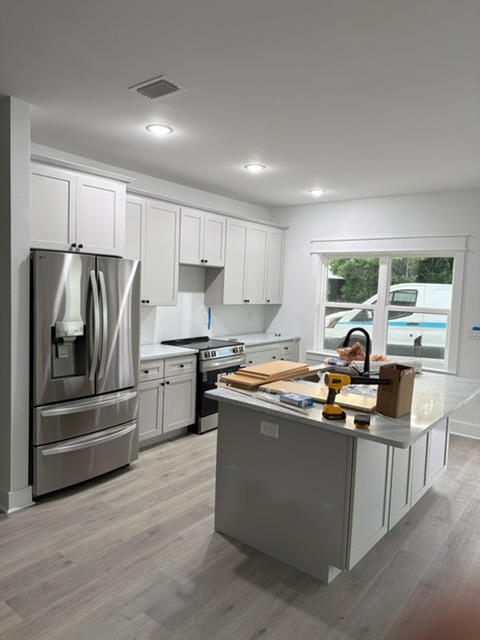 Full White Shaker Kitchen Renovation with Island & Stainless Appliances