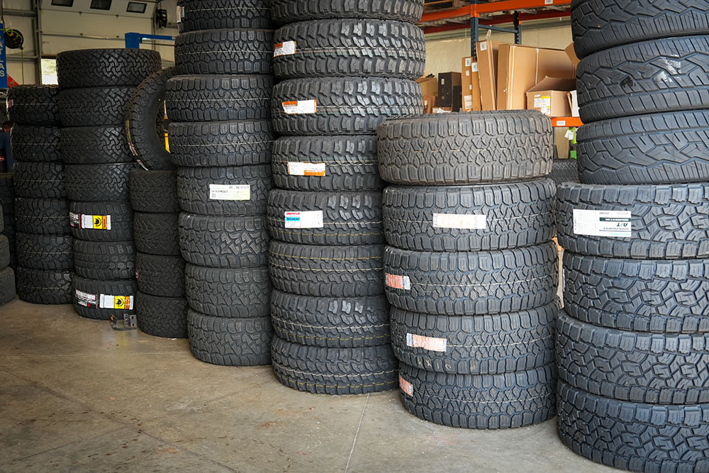 Tire stacks inside Trux Unlimited shop