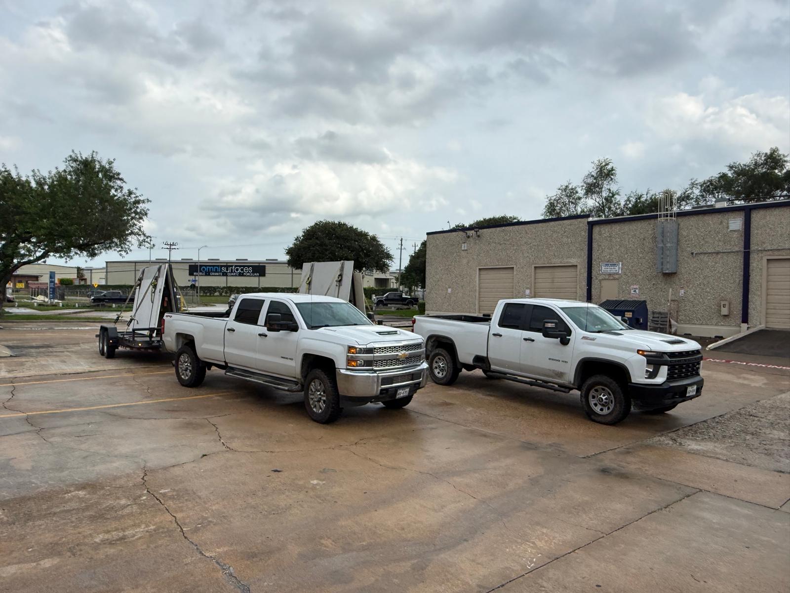 Boulder flatbed truck loaded with stone slabs at a Texas yard