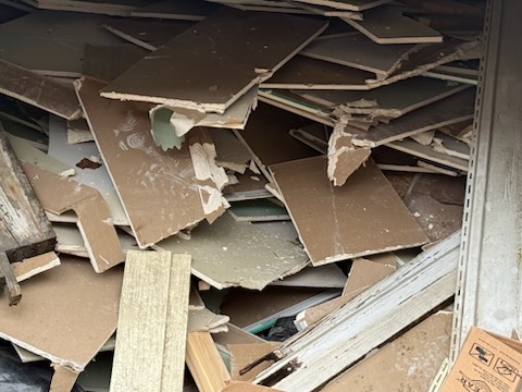 Renovation drywall, trim, vinyl siding and plaster demo pile ready for hauling in Springfield MA
