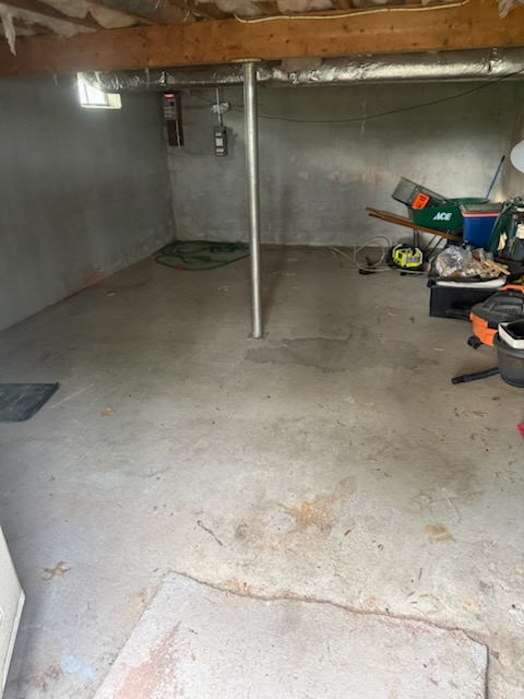 Springfield basement cleanout completely cleared to bare concrete floor by Family Ties Junk Removal