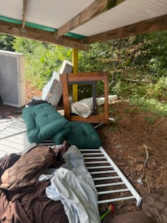 Covered porch before cleanout in Longmeadow MA