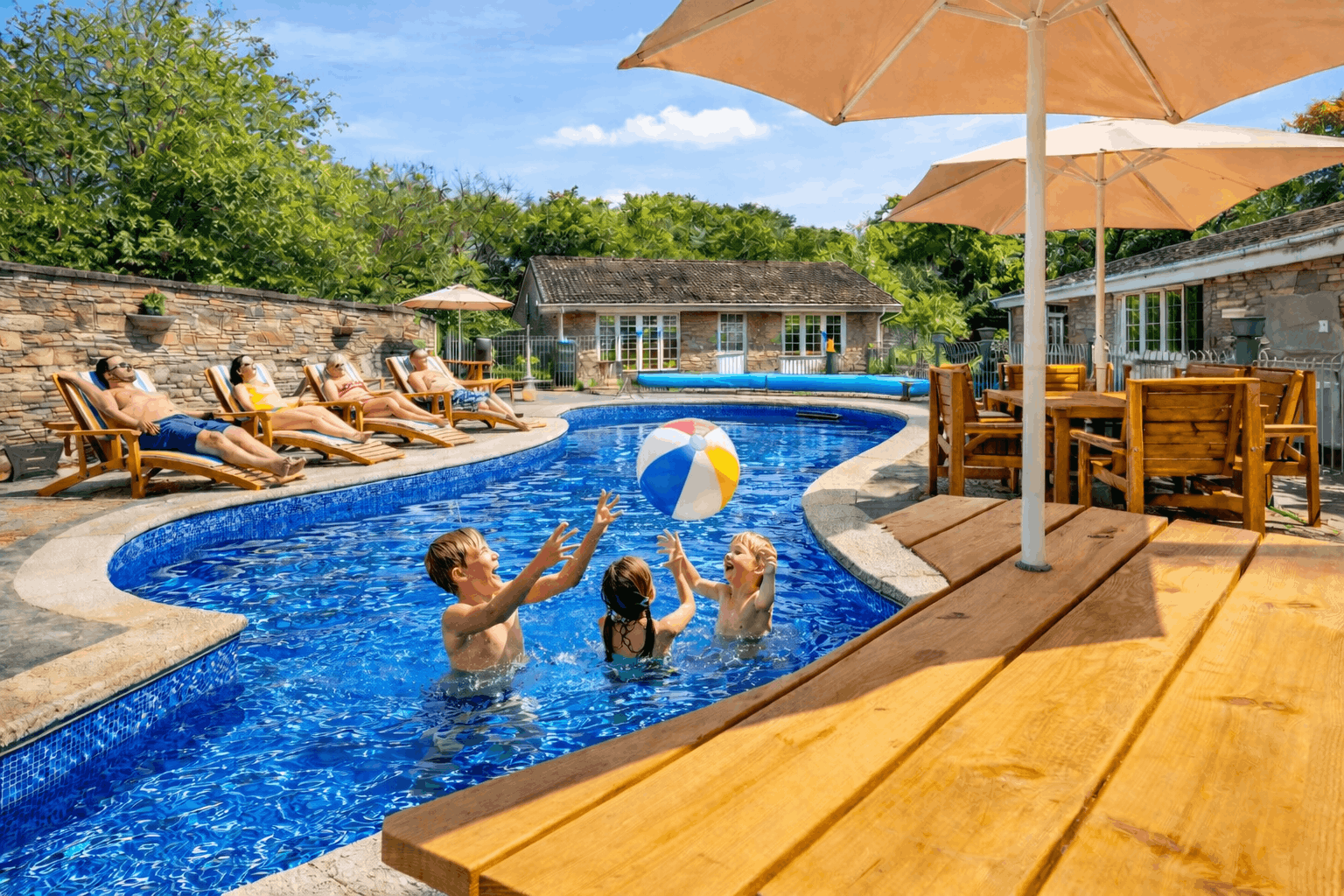 The shared heated outdoor swimming pool at Granite Henge near Looe, Cornwall — open 1 May to 30 September