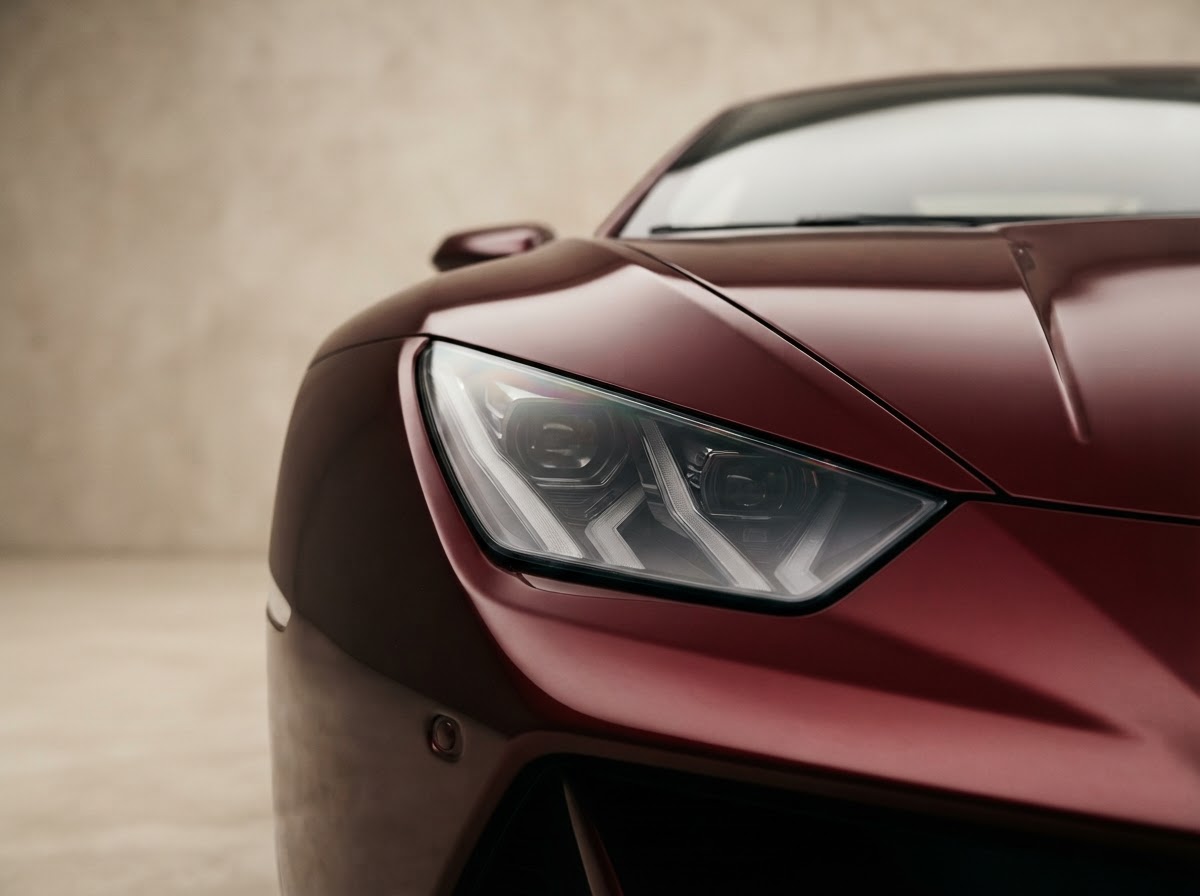 A luxury sports car detail with warm glow lighting in Lodi NJ