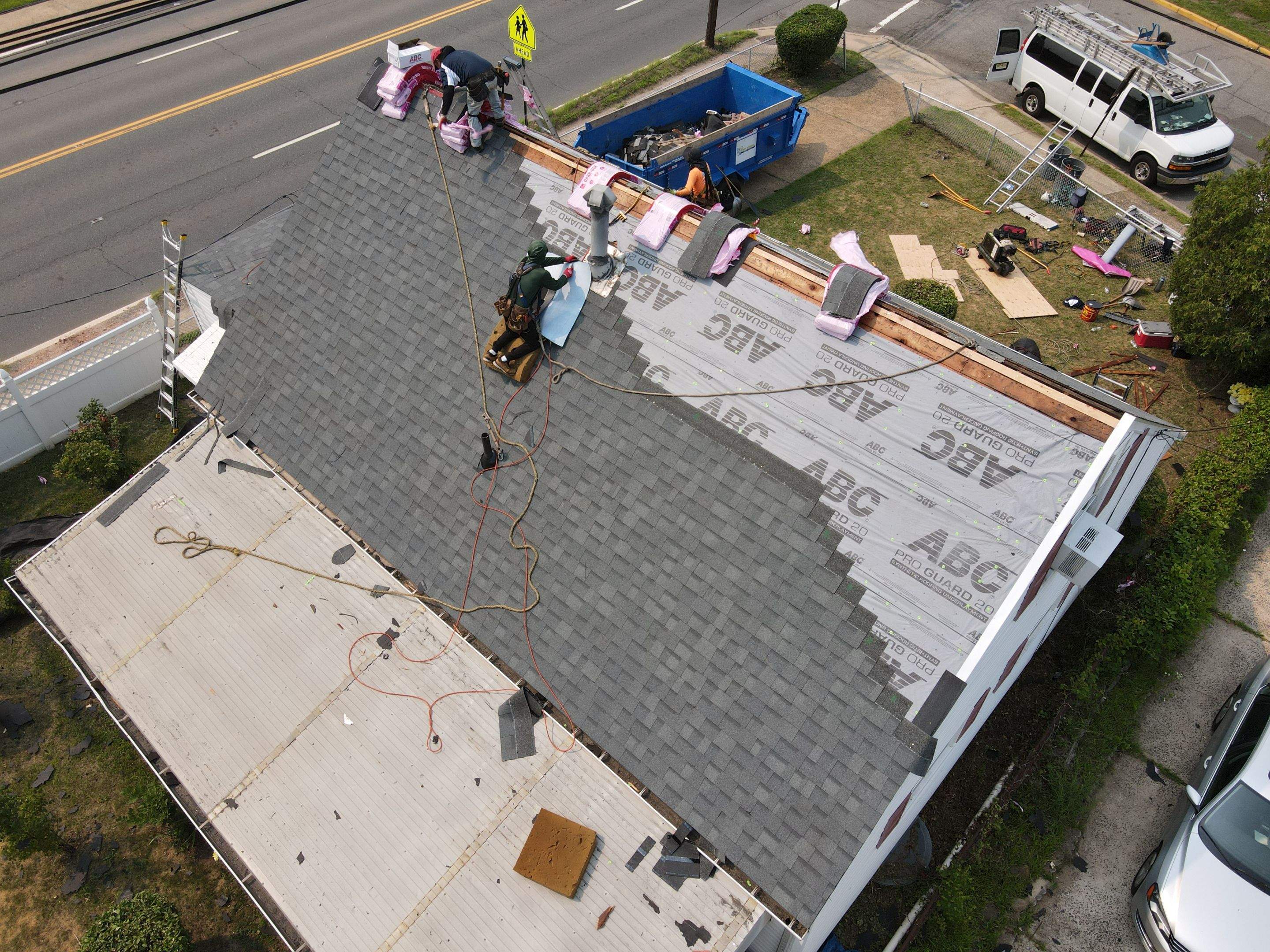 Crews working on the exterior of a local home