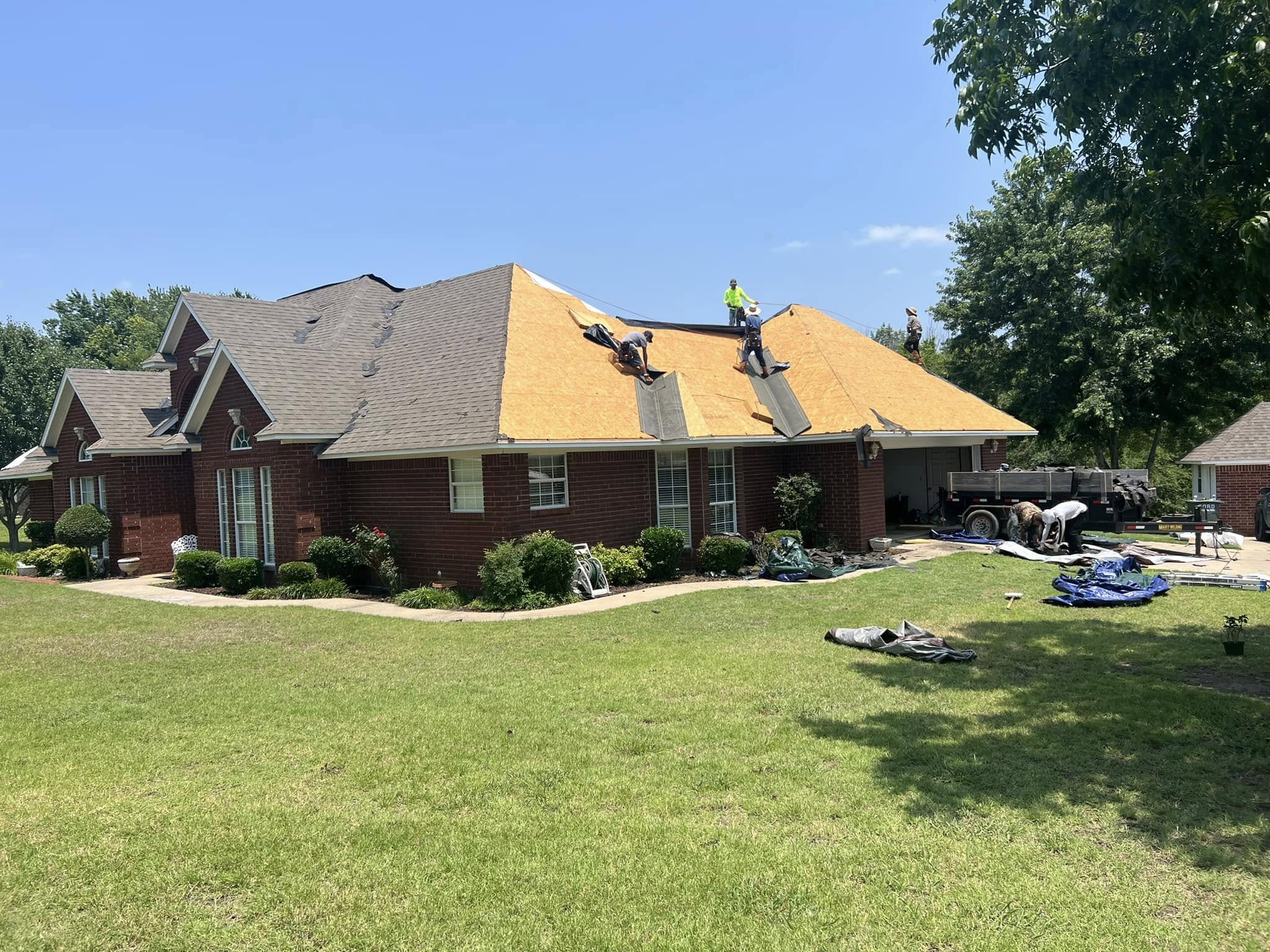 J & H owner and crew on-site stripping shingles and re-decking a roof in the Texoma area
