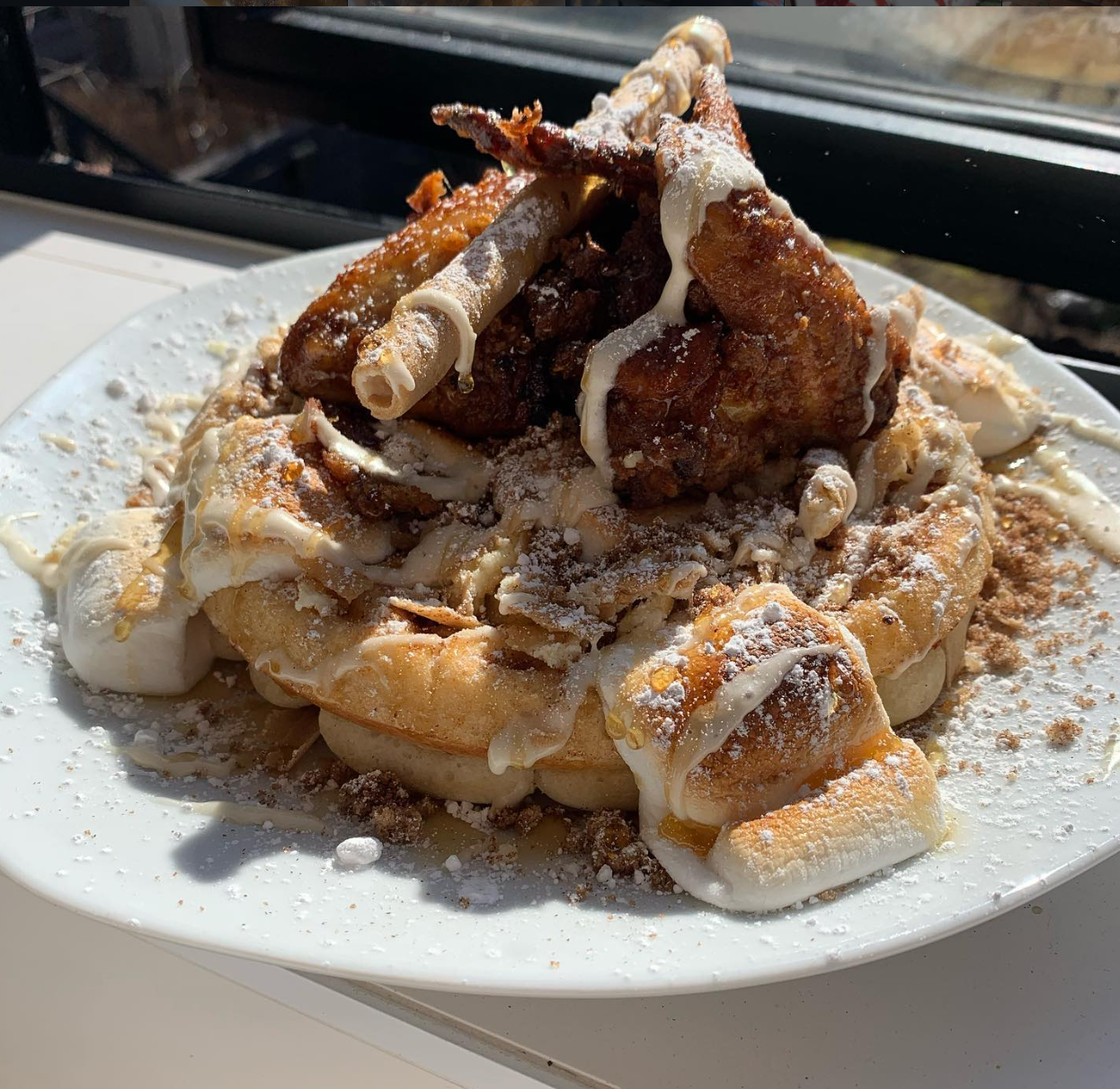 Smoked honey fried chicken over s'mores waffle with toasted marshmallows