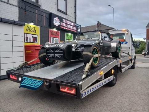 Specialist sports car transported safely on Abu Sultan Recovery flatbed truck