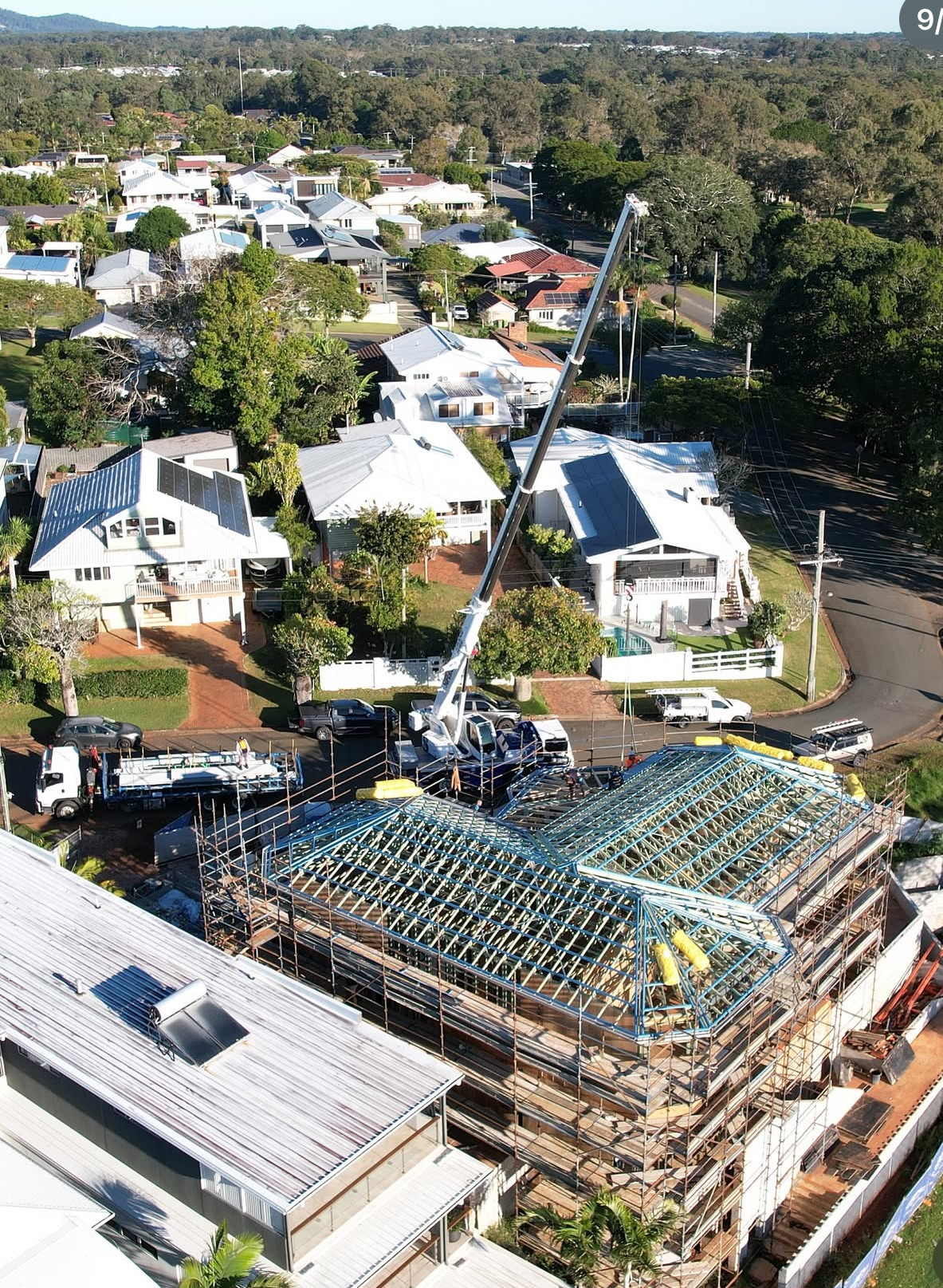 6 Broadwater Tce Redland Bay - Mobile crane lift operations positioning pre-fabricated roof trusses on tight coastal site