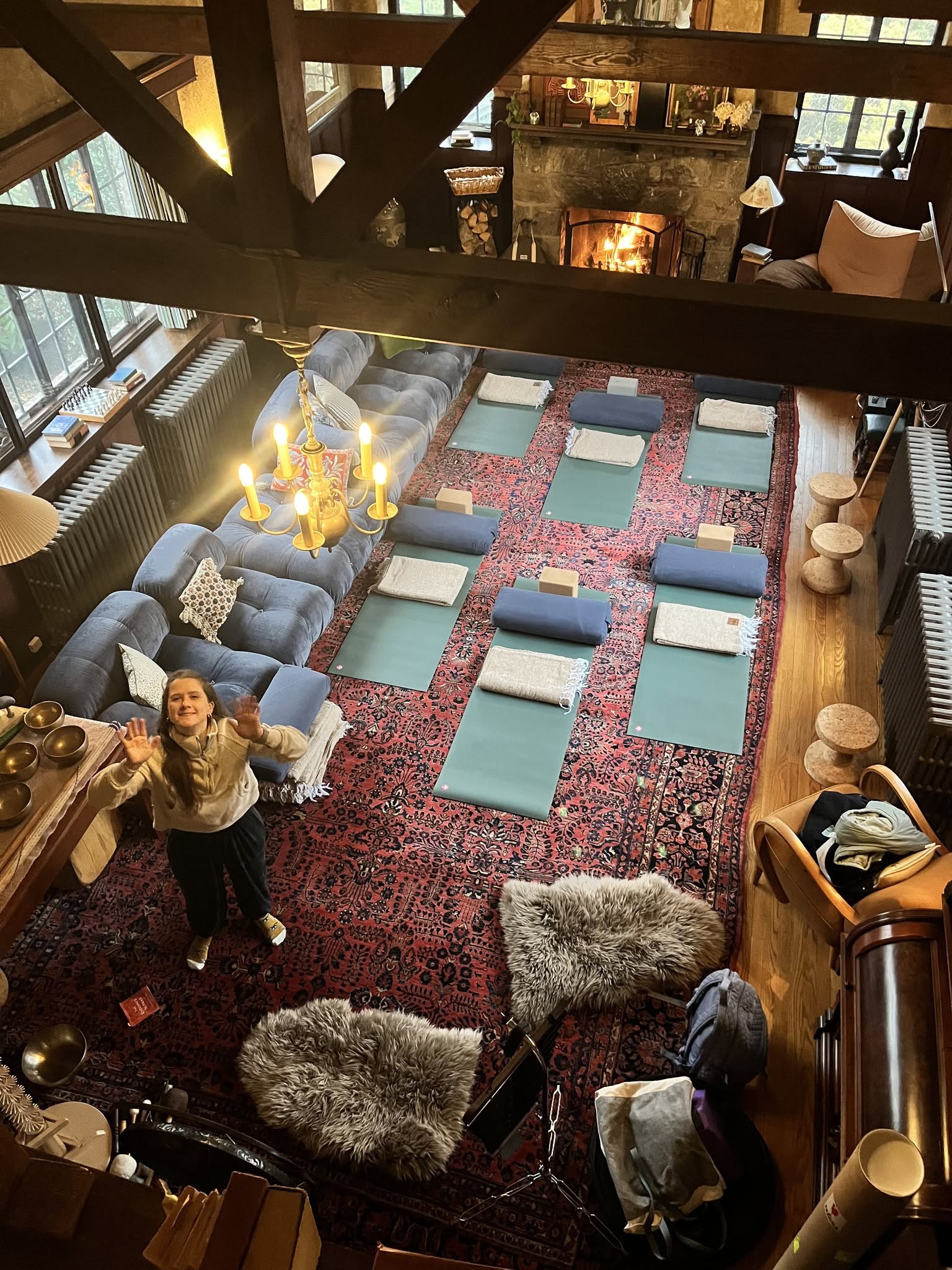 Living room hearth yoga mats and sound bowls setup