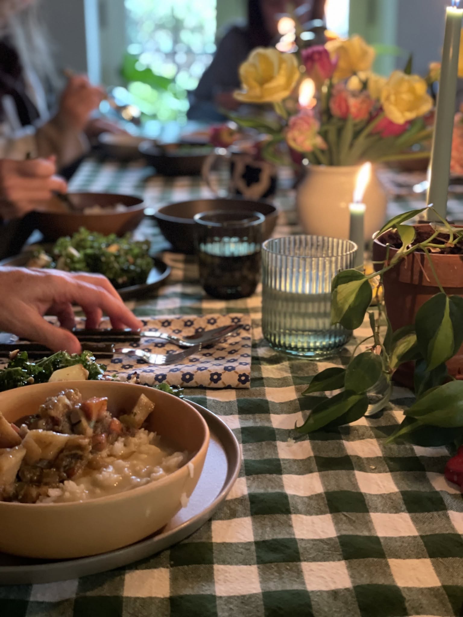 Candlelit farm-to-table dining table with organic nourishment