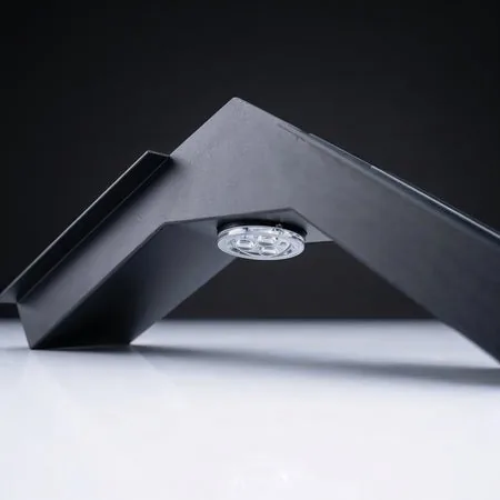 TrueCenter Apex roof-peak track section with centered circular LED puck module.