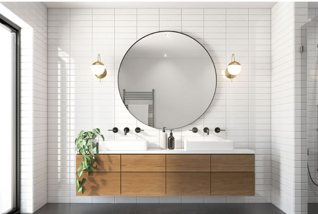 Modern bathroom renovation with circular mirror, timber double vanity and white subway tiles
