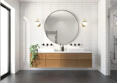 Contemporary bathroom ensuite with large round mirror, floating timber vanity and double sinks