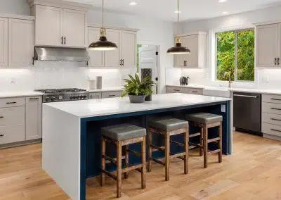 Contemporary white kitchen with island bench and pendant lights
