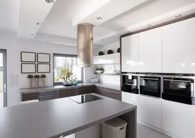 Spacious modern kitchen with island and integrated appliances