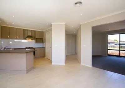 Open plan kitchen alteration with island breakfast bar and tile flooring