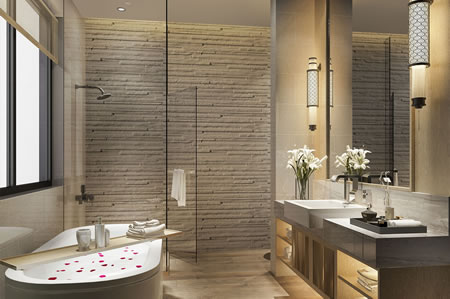 Luxury stone feature wall bathroom with warm vanity lighting