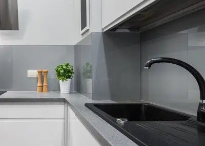 Modern kitchen sink and splashback detail