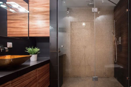 Modern ensuite bathroom with timber cabinetry and walk-in shower