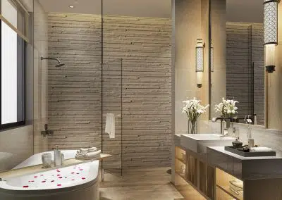 Luxury stone feature wall bathroom with warm vanity lighting and freestanding bath