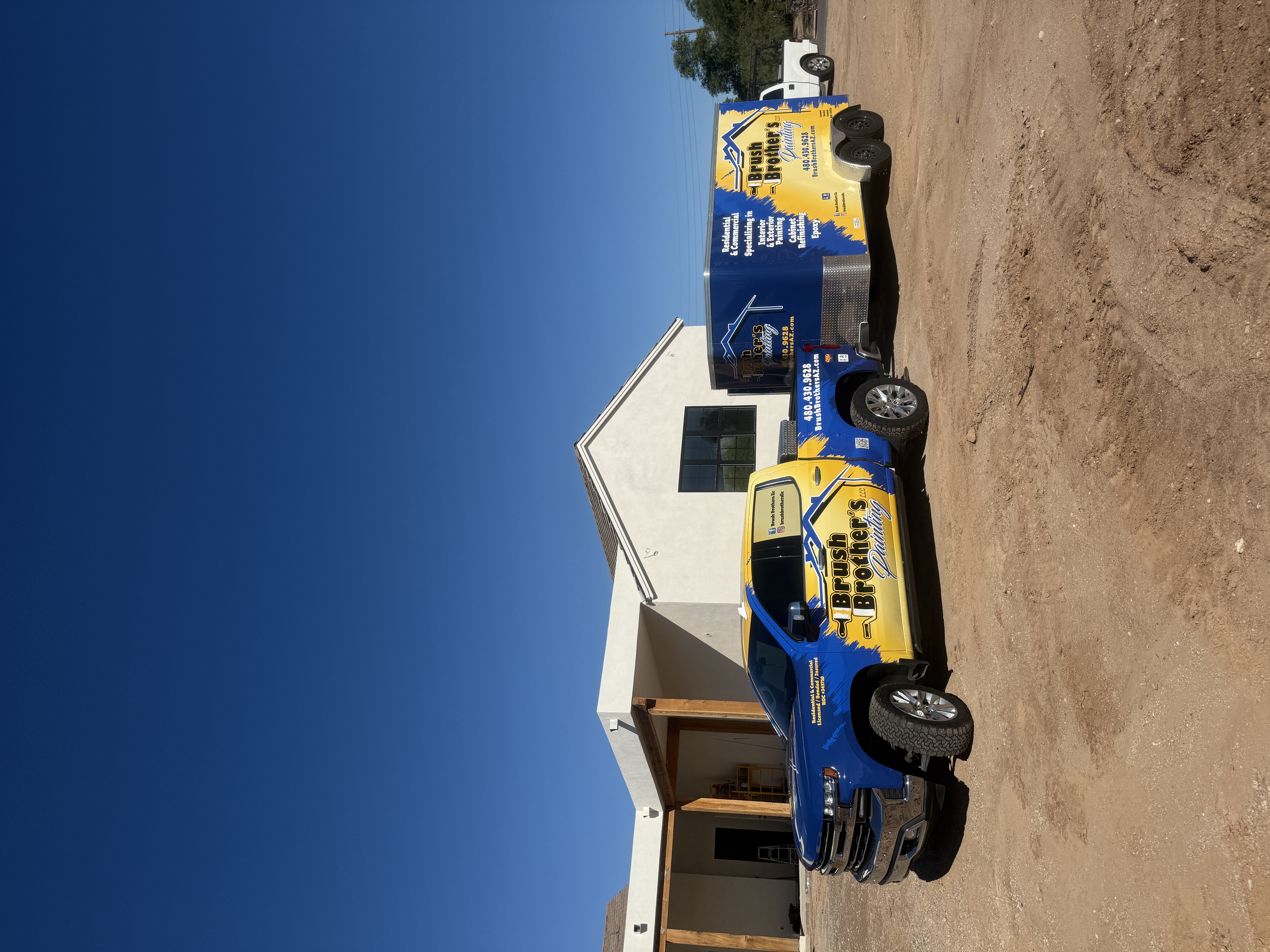 Brush Brother's Painting mobile trailer and custom truck on site at an Arizona residential home