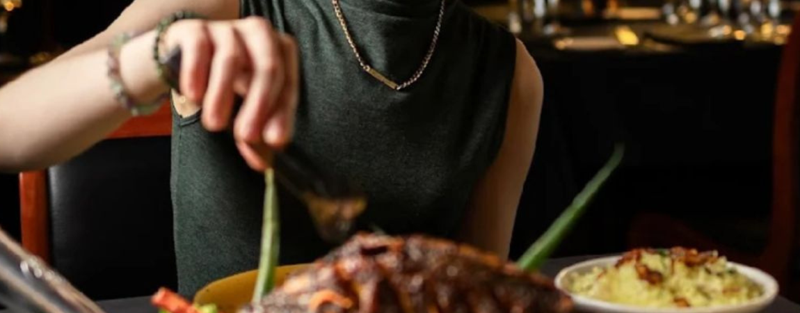 Guest dining around the Waadiya feast with whole fish and rice mains