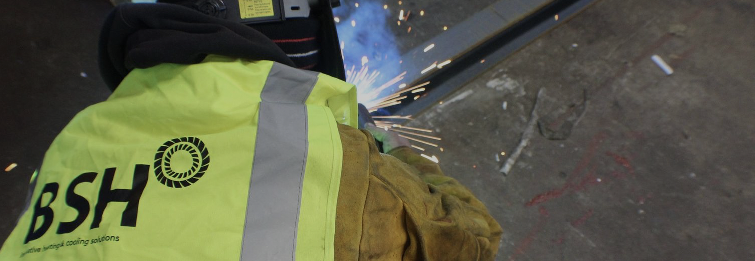 BSH Limited engineer welding during off-site energy plantroom fabrication — over 50 years of heating, cooling and hydrogen engineering expertise
