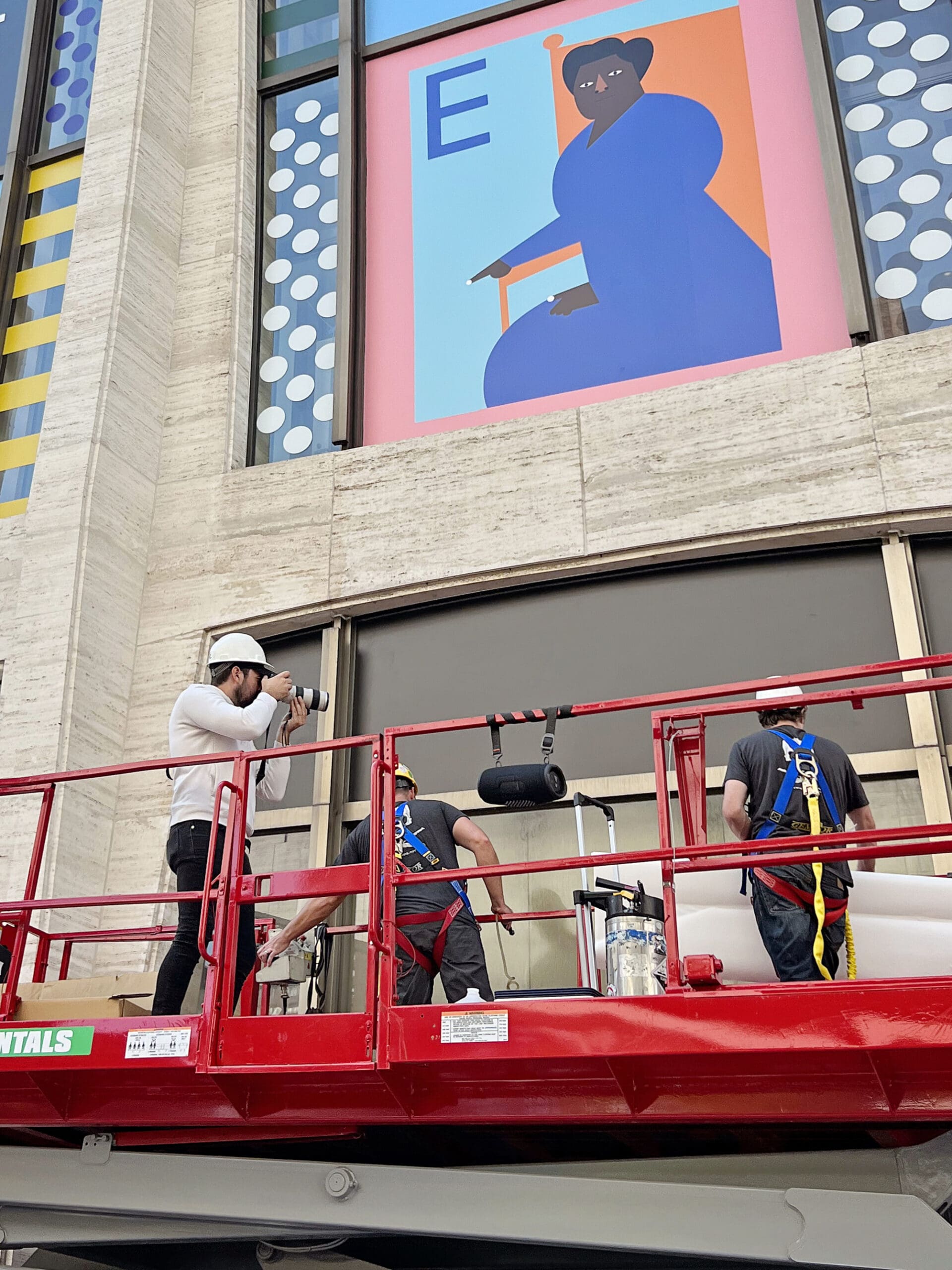 Featured New York project film: Howell Studios videographer filming installation crews from an aerial lift