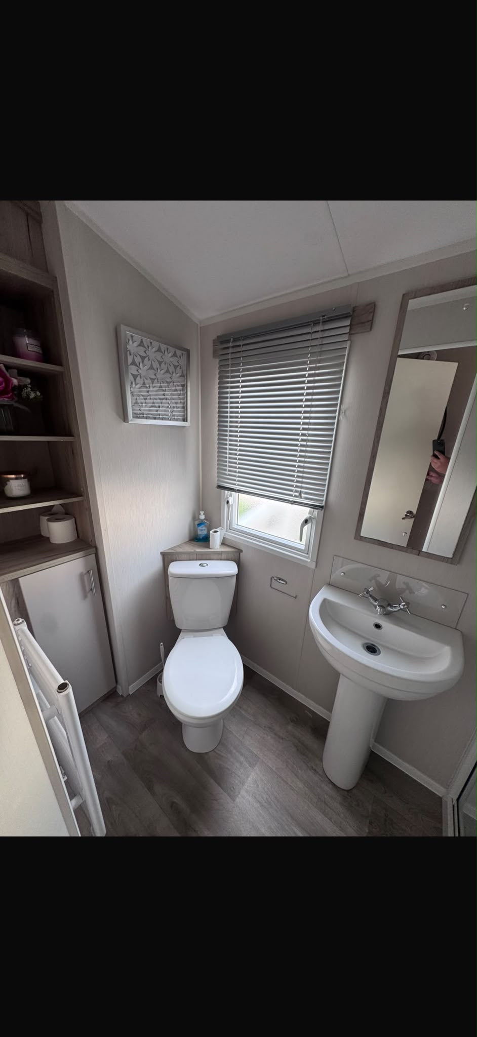 Bathroom suite with toilet, basin, mirror and shower enclosure