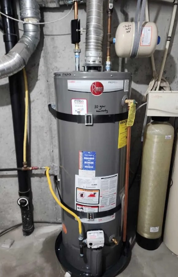 Gas water heater installed by Frosty's Elite Water Heater Service next to a water softener