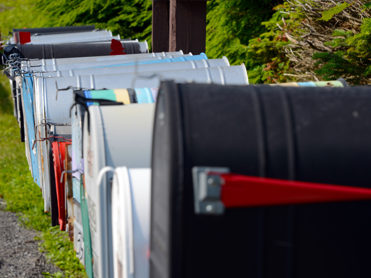 Row of residential mailboxes waiting for carrier delivery