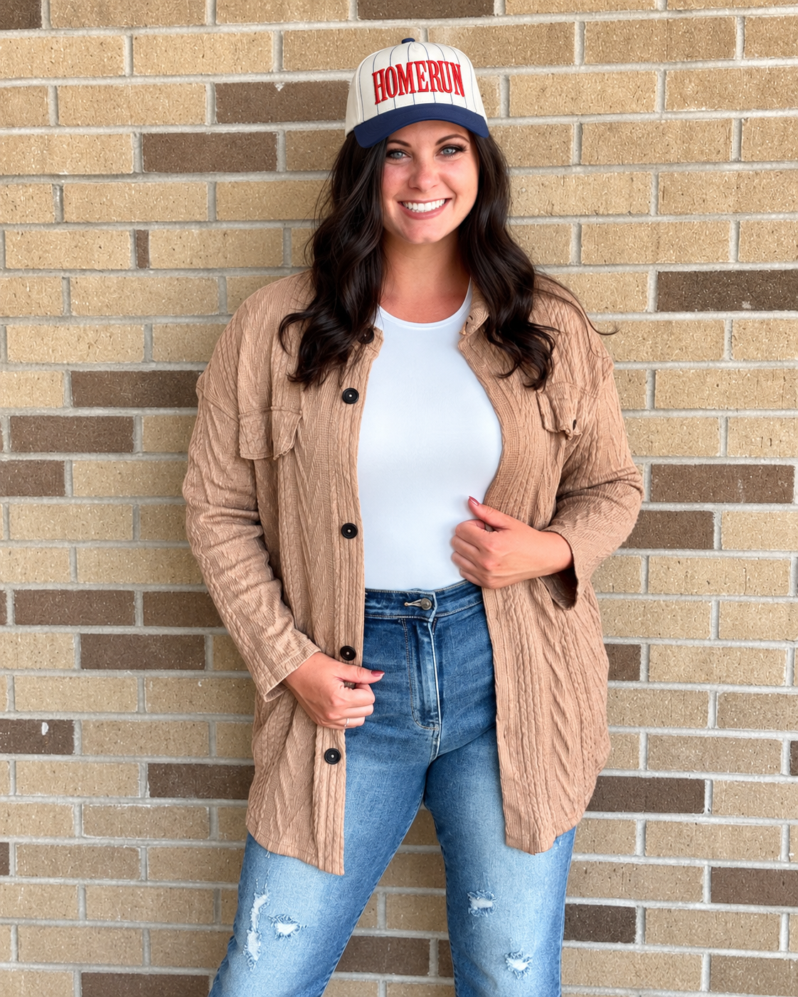 Samantha, owner of Roots & Routes Co., wearing the Homerun Pinstripe Hat
