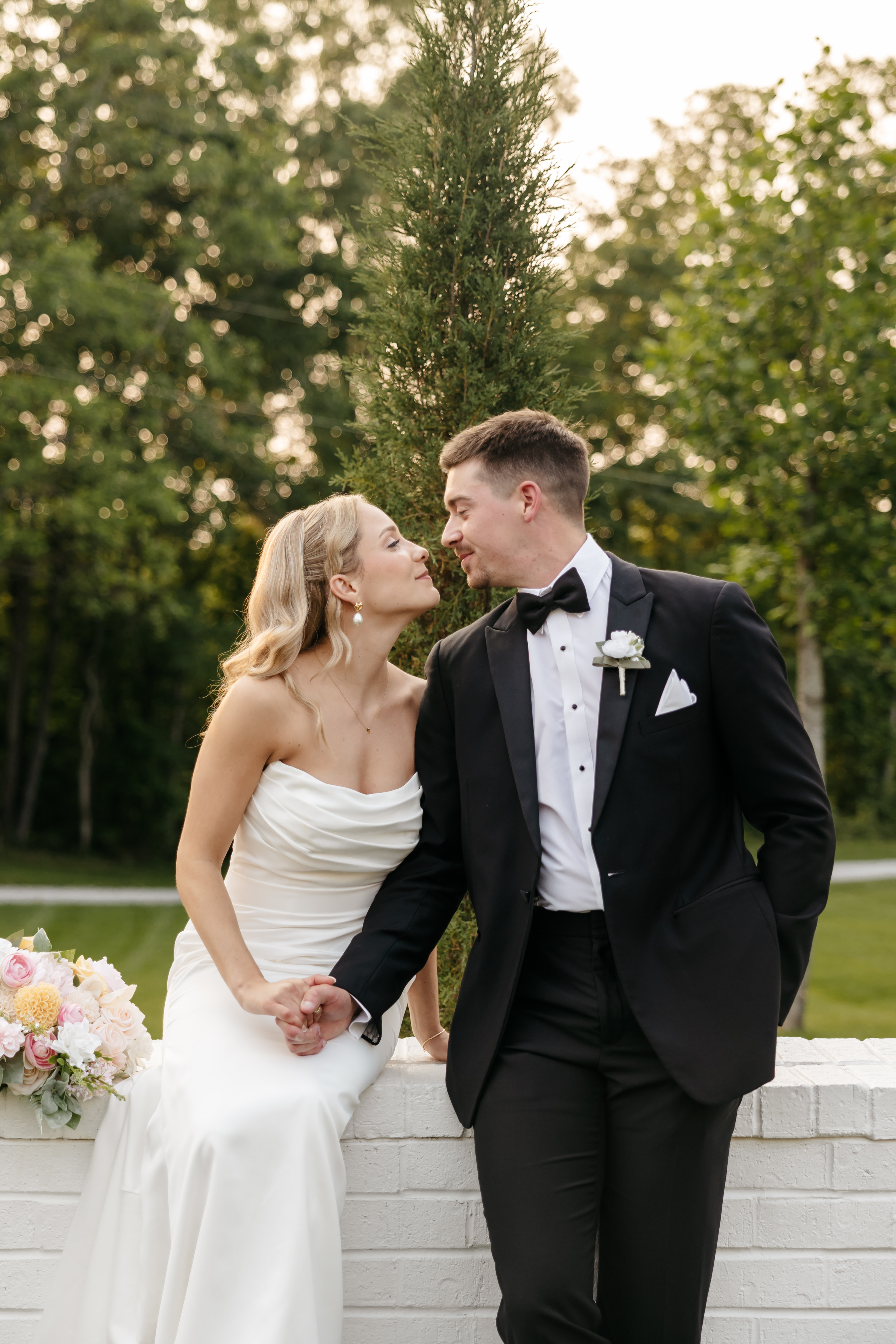 Joyful wedding couple embracing outdoors