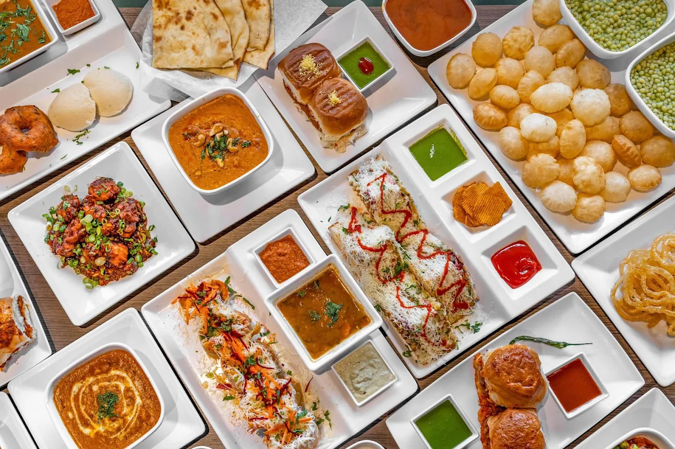 A spread of authentic vegetarian Indian street food dishes at Honest Restaurant