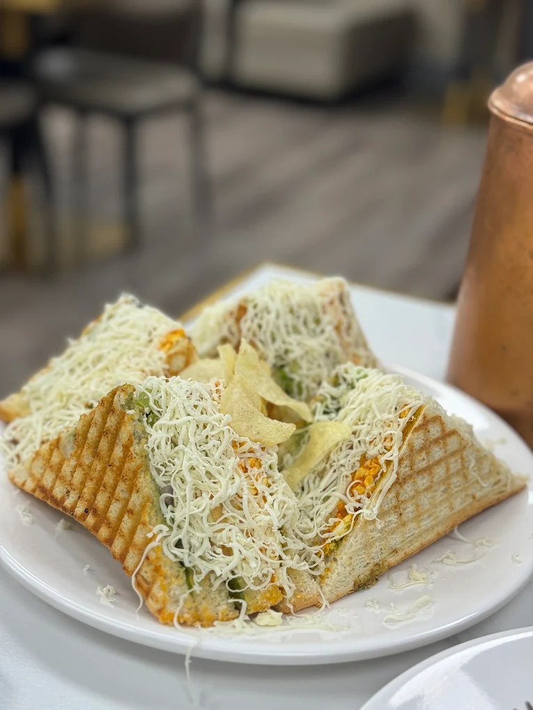 Honest cheese grilled sandwich loaded with melted cheese, fresh veggies and potato wafers