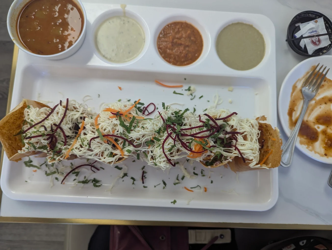 Honest Special Open Cheese Dosa loaded with shredded paneer, cheese, beet shreds and chutneys