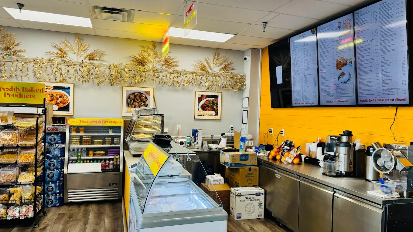 Inside Honest Restaurant St. Peters — ordering counter, fresh juices, sweets display, and menu boards