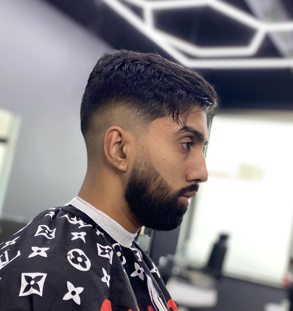 Mid drop fade with styled top and clean edge at The Cut Barber Lounge, Scarborough