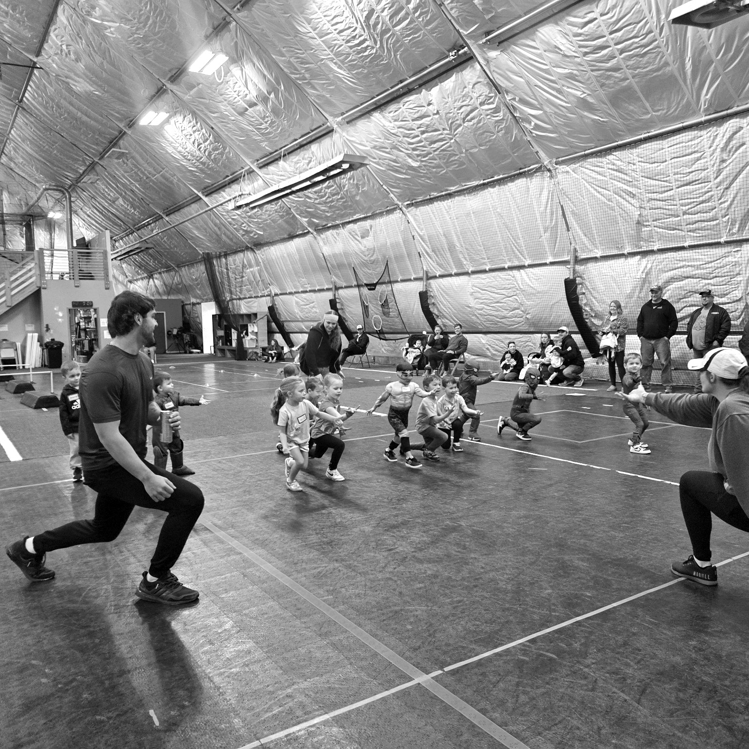 Young children in JJR's Tiny Tots program taking part in movement games and activities
