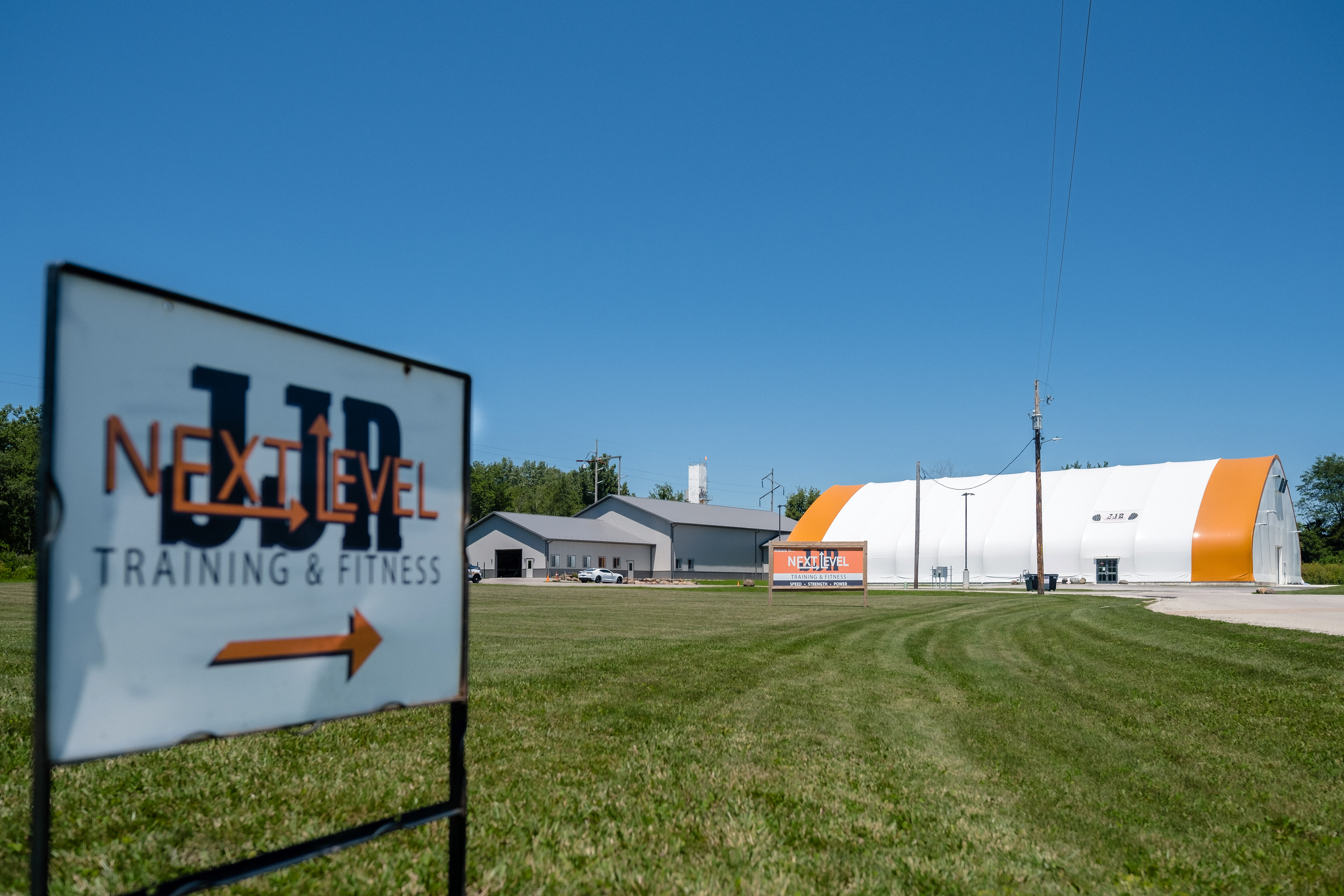 JJR LaSalle facility exterior with sports dome and grass field