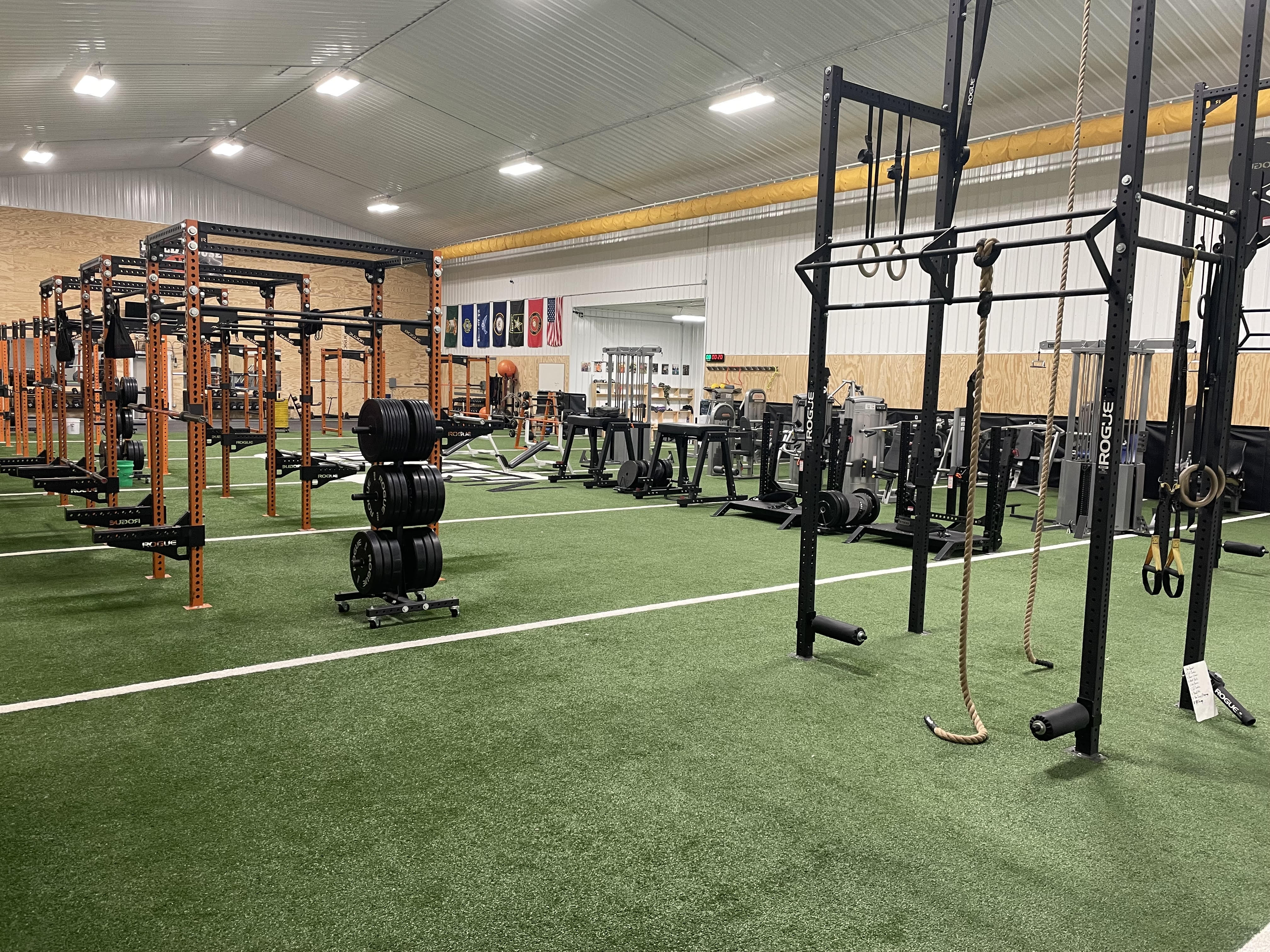 JJR LaSalle weight room with strength training equipment and turf flooring