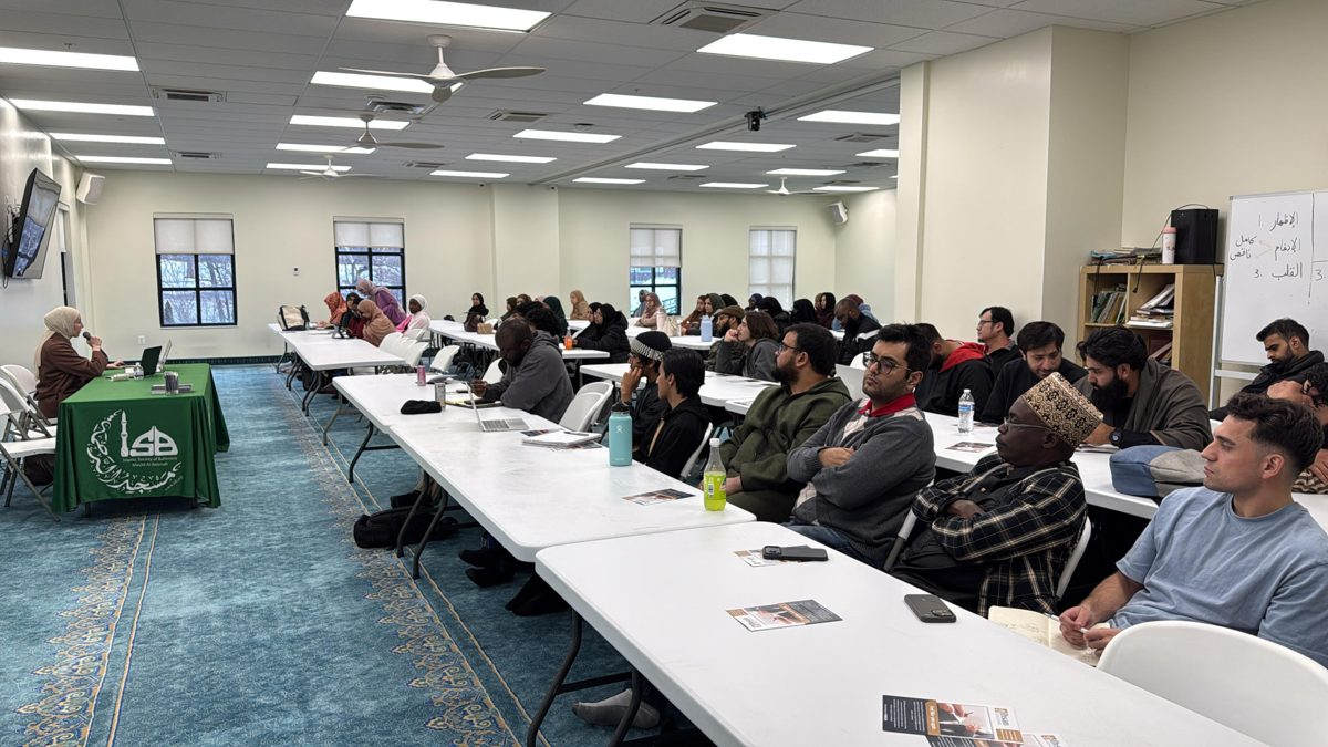 Muslim community marriage workshop with attendees seated at long tables
