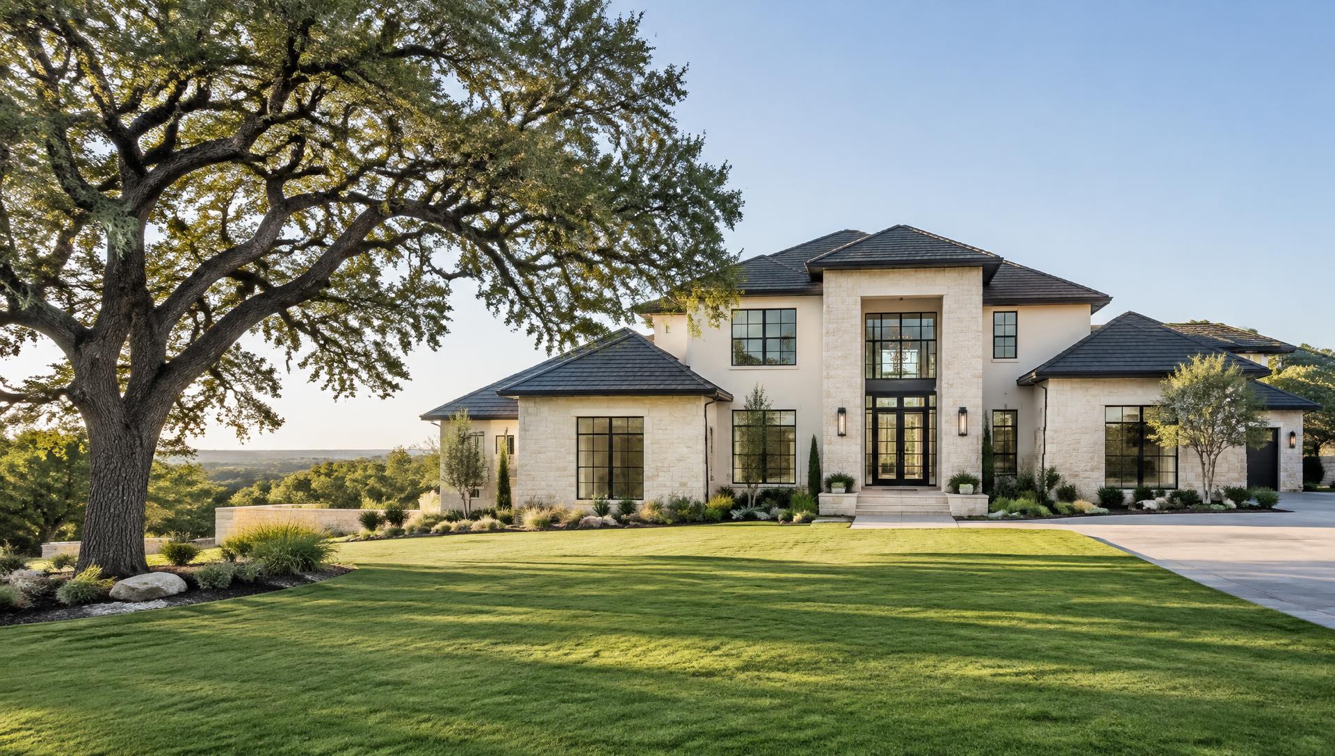 Illustrative newly built Texas home with limestone exterior and landscaped lawn
