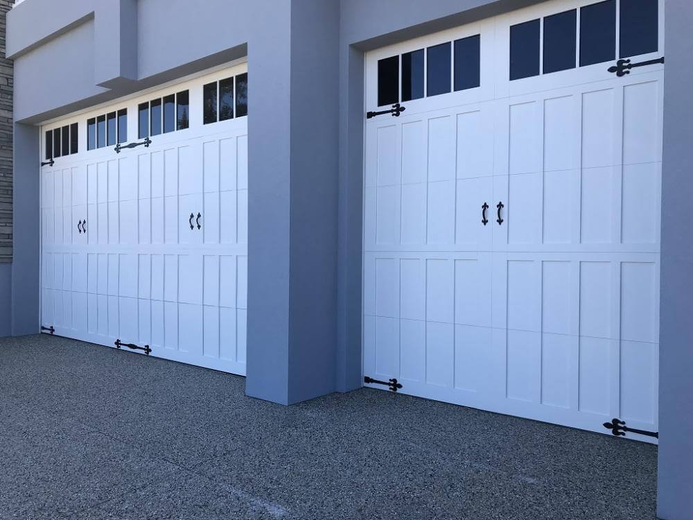 White carriage panel garage doors and hardware for automatic garage door servicing in Dandenong, VIC.